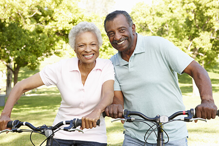 Older African American Couple Riding Bikes